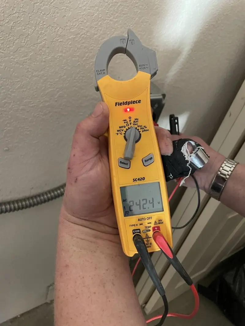 Voltage testing with clamp meter during Circuit Breaker Repair in Portales